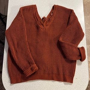 Chunky orange sweater with lace up back. It’s and XL but fits like a medium
